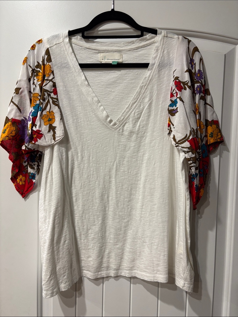 Anthropologie White V-Neck Top with Multicolor Floral Flutter Sleeves